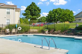 Sparkling outdoor pool with sundeck